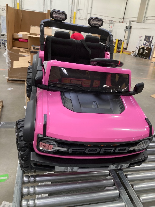 Photo 1 of 24V 2 Seater Ride on Cars, Licensed Ford Bronco Raptor Powered Ride on Toy Truck with Remote Control, Electric Car for Kids 3-8 Gifts with Bluetooth/LED Light/Spring Suspension, 4 Wheelers, Pink