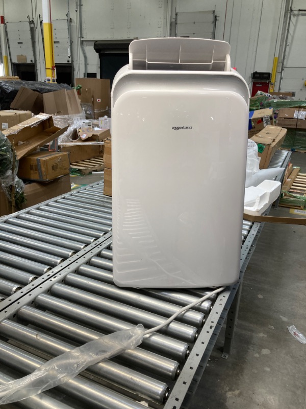 Photo 1 of Amazon Basics Portable AC (Air Conditioner) with Heat Pump, Dual Purpose (Cool and Warm), Cools 550 Square Feet, With Remote Control and Timer, 13,000 BTU ASHARE / 10000 BTU SACC, White