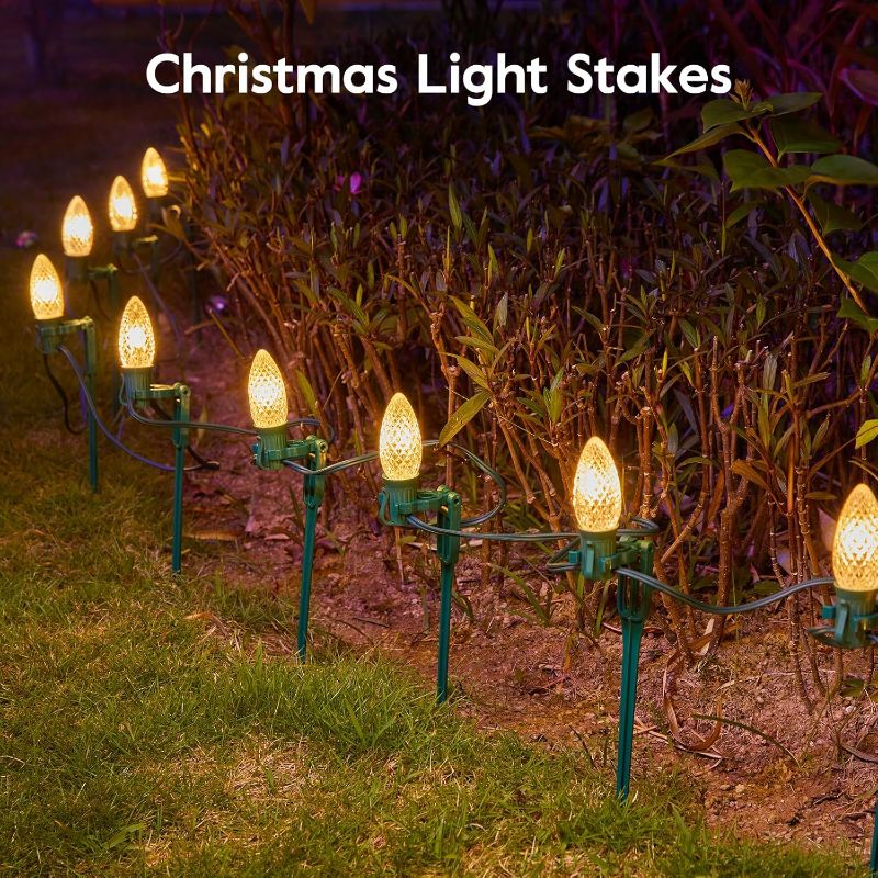 Photo 2 of 100-Pack Plastic Light Stakes, 7.5 Inch Christmas Yard Stakes for C7 C9 Christmas String Lights, Universal Outdoor Light Holders for Outdoor Holiday Lights Use on Garden Lawn Patio Path Walkway