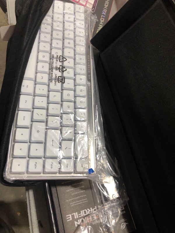 Photo 1 of ASUS ROG Falchion RX Low Profile 65% Wireless Gaming Keyboard with ROG RX Blue Low-Profile switches, tri-Mode Connection, Protective Cover, Silicone dampening Foam, Touch Panel, and MacOS Support.