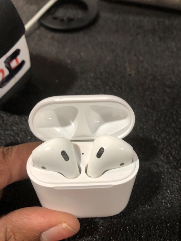 Photo 1 of Apple AirPods Wireless Ear Buds, Bluetooth Headphones with Lightning Charging Case Included, Over 24 Hours of Battery Life, Effortless Setup for iPhone