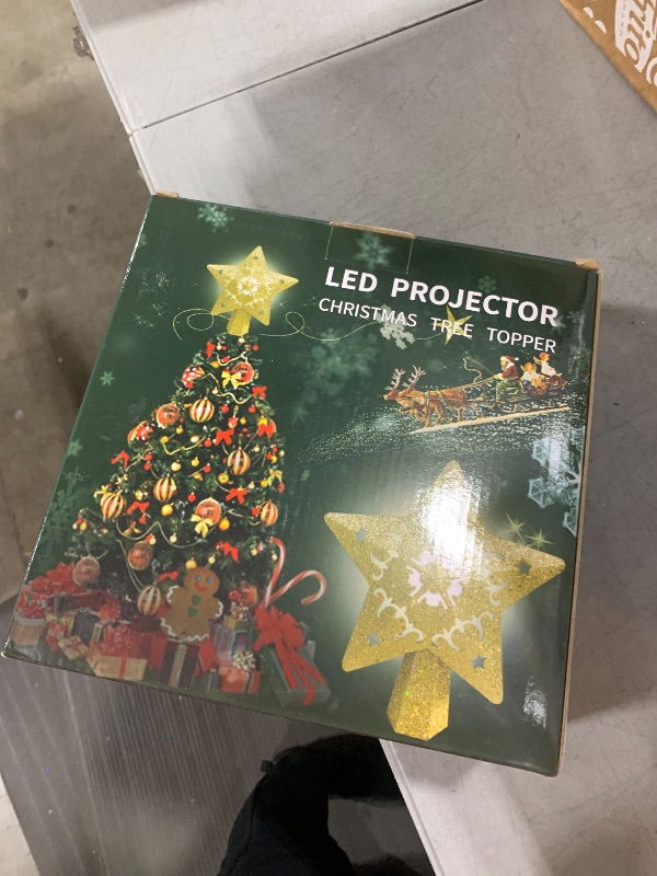 Photo 1 of AOMIL Christmas Tree Topper, 3D Rotating Pattern Projector for Xmas Tree Topper, Hollow Design Christmas Decorations,Christmas Decor