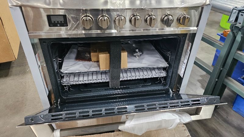 Photo 1 of badly dented
RANGAIRE RRG361TS 36" Gas Range, 5 Sealed Burners, 4.3 cu. Ft. Capacity, Freestanding Slide-in Convection Oven, Easy Reach Racks, Clock and Timer, Stainless Steel