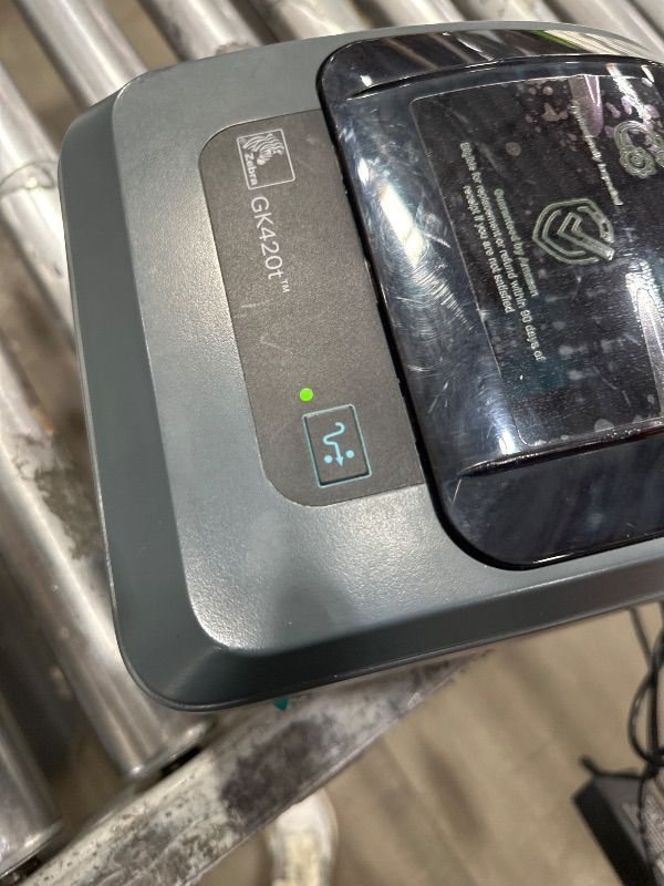 Photo 1 of ***(NO RETURNS OR REFUNDS/ FOR PARTS ONLY/ NON FUNCTIONAL)***
ZEBRA GK420t Thermal Transfer Monochrome Desktop Printer Print Width of 4 in USB and Ethernet Port Connectivity GK42-102210-000