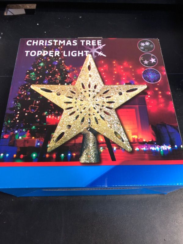 Photo 1 of Samyoung Christmas Tree Topper Lighted with 6 Projection Modes Star Tree Topper Built-in LED Rotating 3D Lighted Glitter Star Decorations Projector Tree Topper for Christmas Tree