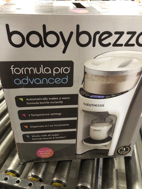 Photo 1 of Baby Brezza New and Improved Formula Pro Advanced Formula Dispenser Machine - Automatically Mix a Warm Formula Bottle Instantly - Easily Make Bottle with Automatic Powder Blending, White