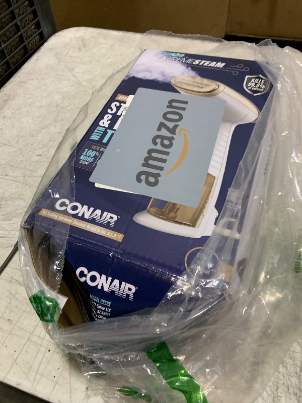Photo 1 of Conair Handheld Garment Steamer for Clothes, Turbo ExtremeSteam 1875W, Portable Handheld Design, Strong Penetrating Steam, White / Champagne
