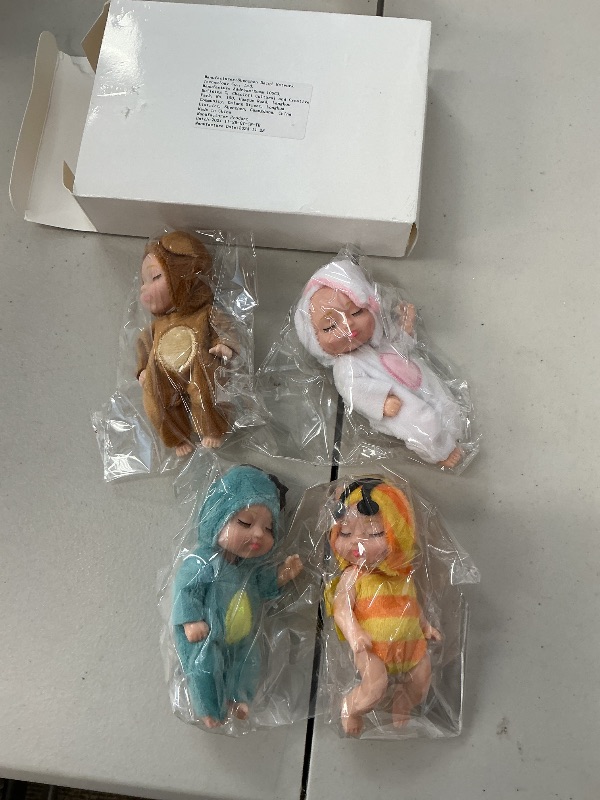 Photo 1 of Hanaive 4 Pcs 4 Inch Mini Baby Dolls Lifelike Realistic Baby Dolls Animal Clothes Cute Tiny Gifts for Kids Birthday Party(Cute Style)