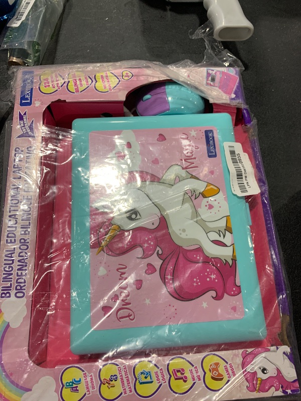 Photo 1 of LEXiBOOK - Unicorn Educational and Bilingual Laptop Spanish/English - Toy for Children with 124 Activities to Learn Mathematics, Dactylography, Logic, Clock Reading, Play Games and Music - JC598UNIi2