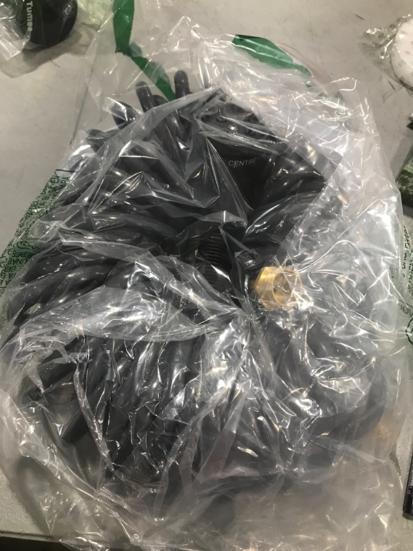 Photo 1 of Coil Hose 50FT EVA Coil Garden Hose With 3/4'' Brass Connector Coiled Water Hose Lightweight And No Kink Includes 7 Patterns Spray Nozzle For Outdoors Lawn Watering Car Washing