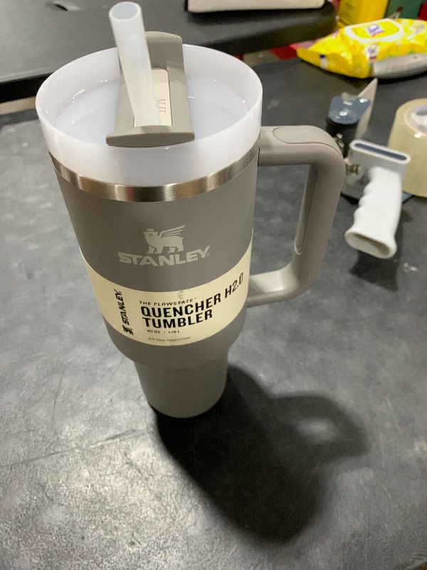 Photo 1 of Stanley Quencher H2.0 Tumbler with Handle and Straw 40 oz | Flowstate 3-Position Lid | Cup Holder Compatible for Travel | Insulated Stainless Steel Cup | BPA-Free | Stone
