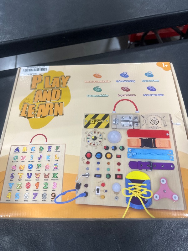 Photo 1 of 23 in 1 Busy Board Montessori Toys for 1-3 Year Old Wooden Learning Educational Toys for Toddlers with 15 Switches, 26 LED Lights, Music Boxes, Locks,Zippers Toddler Sensory Toys for Soothing A Baby