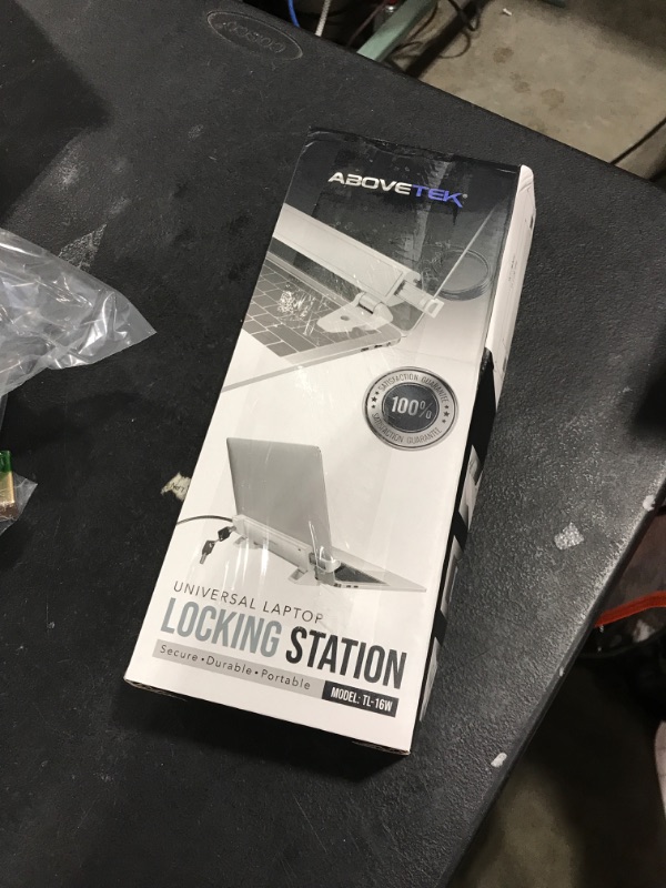 Photo 1 of AboveTEK MacBook & Surface Laptop Locking Station with Combo Lock Cable, Anti Theft Folding Security Laptop Desk Mount, Adjustable & Portable, Fits 12"-16" Laptops/Notebooks (White)