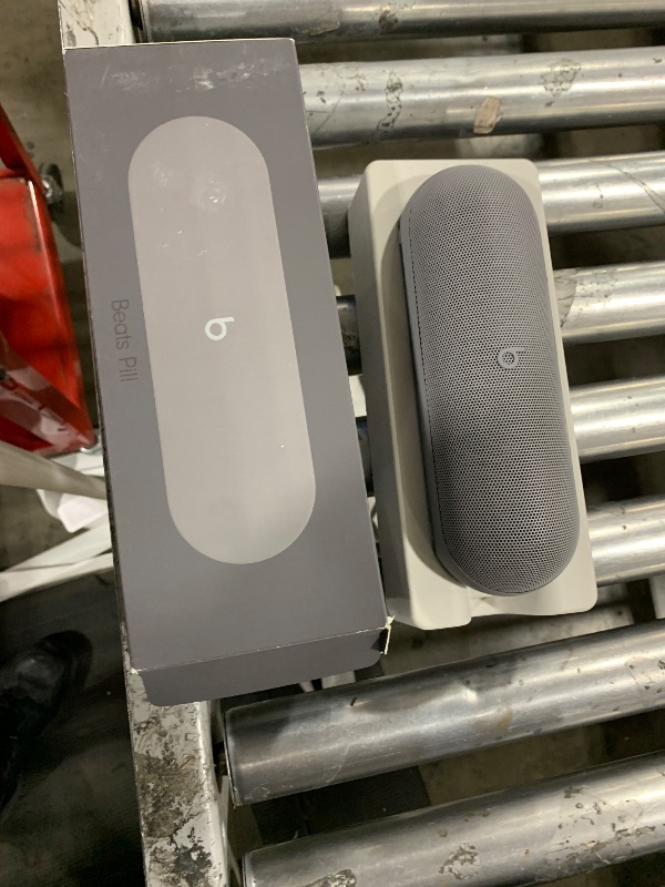 Photo 1 of Beats Pill x Kim Kardashian - Wireless Bluetooth Speaker and Portable Charger via USB-C - Up to 24 Hours Battery Life, IP67 Water Resistant, Apple & Android Compatible, Built-in Mic – Dark Gray