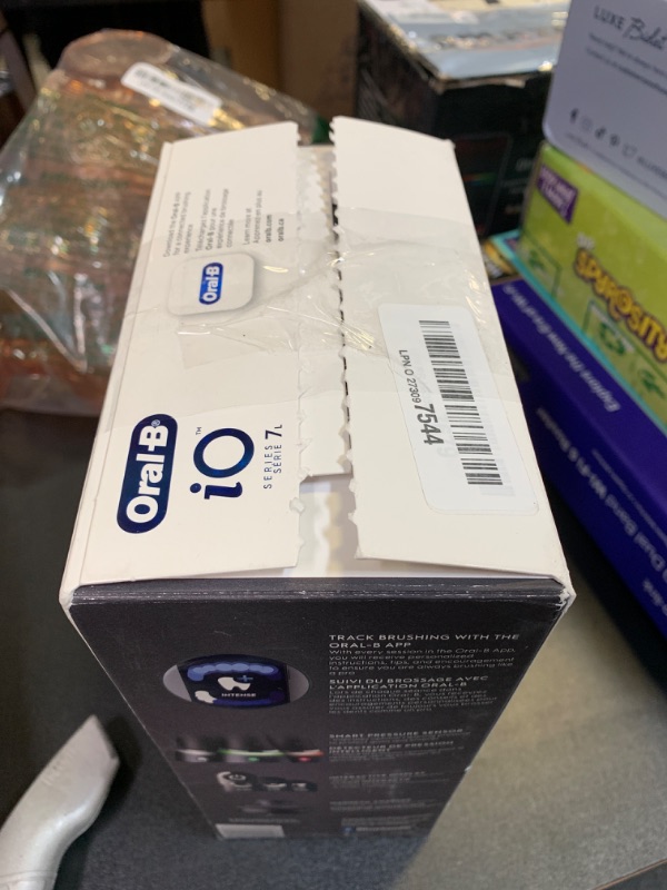 Photo 1 of Oral-B iO Deep Clean + Protect Rechargeable Electric Toothbrush, Black with a iO Series 7 Toothbrush, 2 Replacement Brush Heads, and a Charging Travel Case
