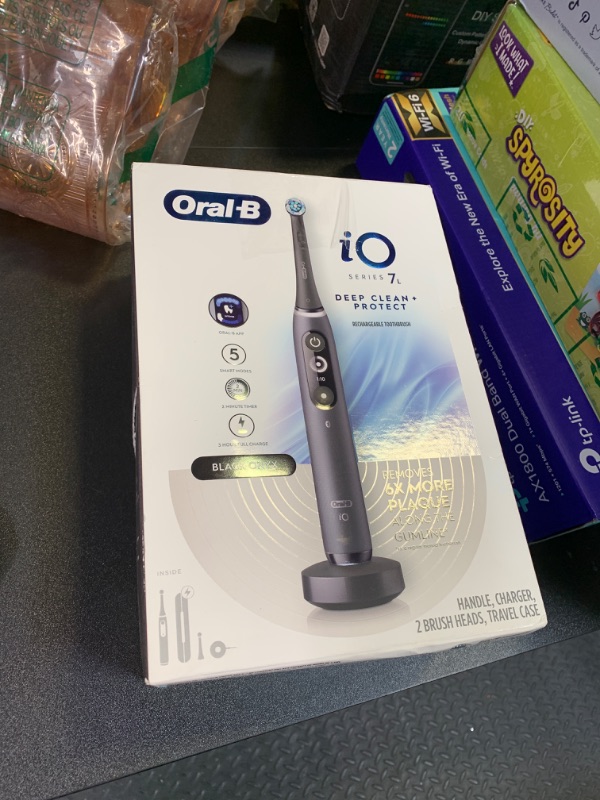 Photo 1 of Oral-B iO Deep Clean + Protect Rechargeable Electric Toothbrush, Black with a iO Series 7 Toothbrush, 2 Replacement Brush Heads, and a Charging Travel Case