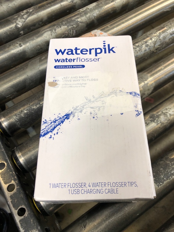 Photo 1 of Waterpik Cordless Pearl Rechargeable Portable Water Flosser for Teeth, Gums, Braces Care and Travel with 4 Flossing Tips - ADA Accepted, WF-13 White, Packaging May Vary
