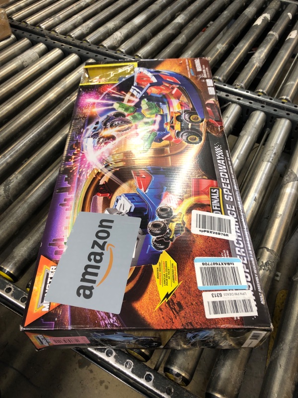 Photo 1 of Monster Jam, Supercharge Speedway Playset, Megalodon and El Toro Loco Die-Cast Monster Trucks, Light Up World Finals Track Kids Toys for Boys Ages 3+