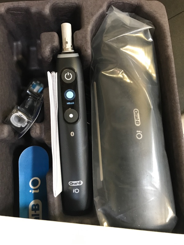 Photo 4 of Oral-B iO Deep Clean + Protect Rechargeable Electric Toothbrush, Black with a iO Series 7 Toothbrush, 2 Replacement Brush Heads, and a Charging Travel Case