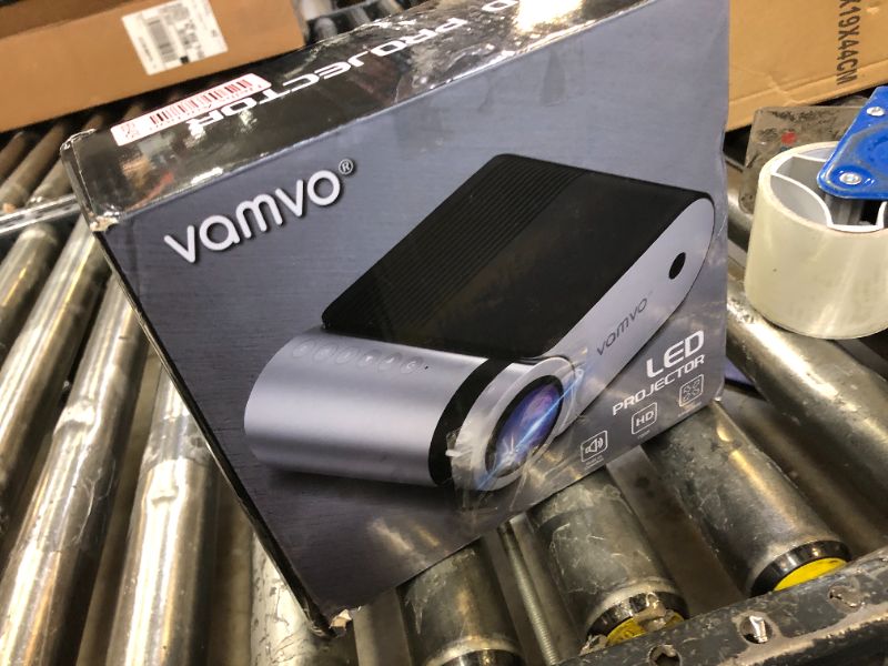 Photo 2 of **SOLD FOR PARTS**
Mini Projector, Vamvo Portable Projector Support 1080P 200" Mini HD Movie Projector, Outdoor Projector with Stylish streamlined Design, Compatible with phone/ Tablet/ Laptop/ TV Stick/ PS4 etc.