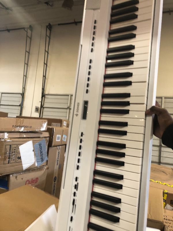 Photo 1 of Donner DEP-20 Beginner Digital Piano 88 Key Full Size Weighted Keyboard, Portable Electric Piano with Furniture Stand, 3-Pedal Unit, White
