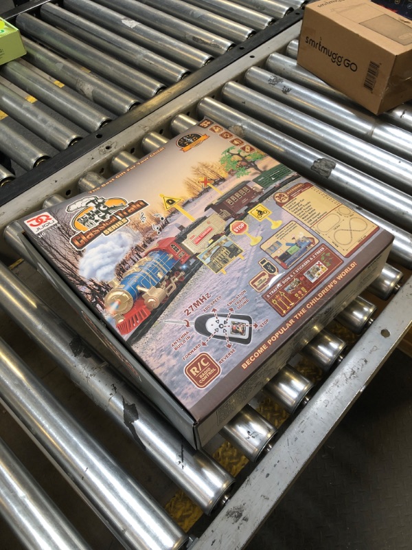 Photo 1 of JUQU Train Set for Boys -Remote Control Train Toys-Electric Train w/Smokes, Steam Locomotive w/Lights & Sound, Cargo Car and Tracks, Rechargeable Battery Christmas Toy Train for Age 3 4 5 6 7 8+ Kids