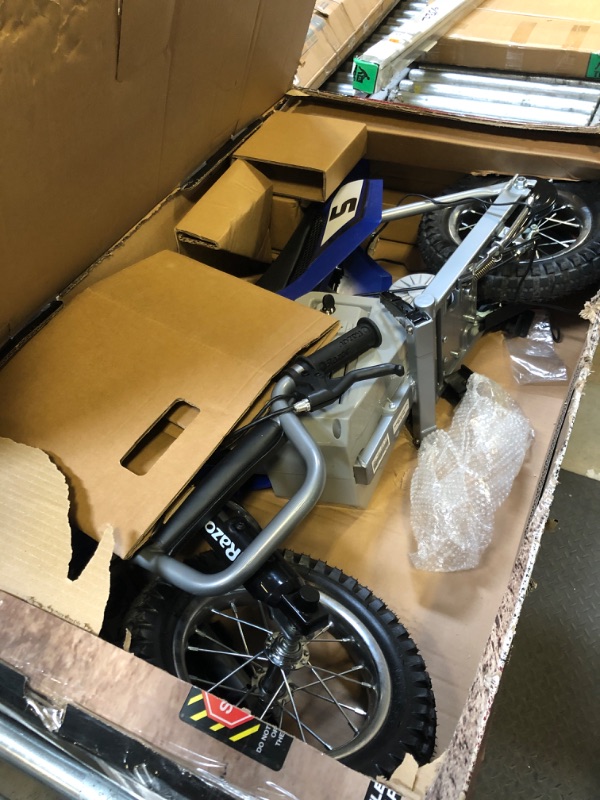 Photo 1 of Razor MX350 Dirt Rocket Electric Motocross Off-Road Bike for Age 13+, Up to 30 Minutes Continuous Ride Time, 12" Air-Filled Tires, Hand-Operated Rear Brake, Twist Grip Throttle, Chain-Driven Motor