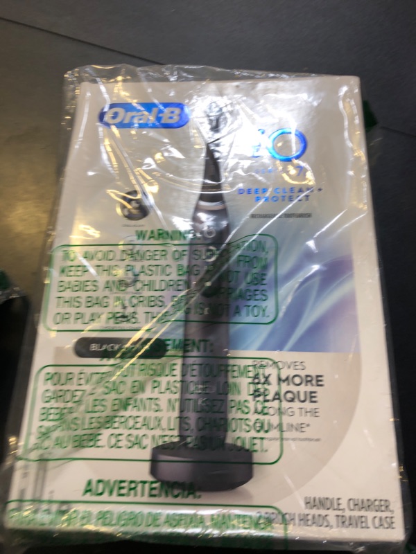 Photo 1 of Oral-B iO Deep Clean + Protect Rechargeable Electric Toothbrush, Black with a iO Series 7 Toothbrush, 2 Replacement Brush Heads, and a Charging Travel Case