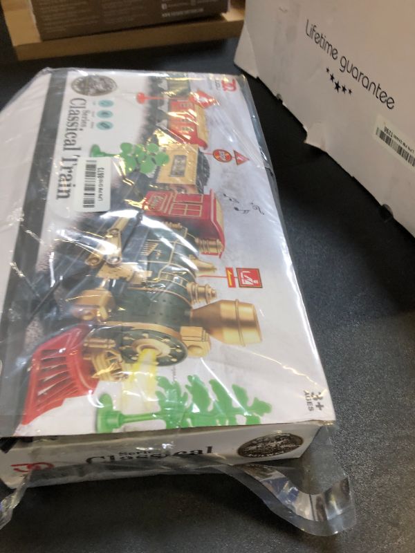 Photo 1 of JUQU Train Set-Electric Train Sets for Boys Toddlers Classical Train Toys,Battery-Powered Locomotive Engine with Sound and Lights, 3 Cars &10 Tracks, Christmas Toy Train for Age 3 4 5 6 Years Old Kids