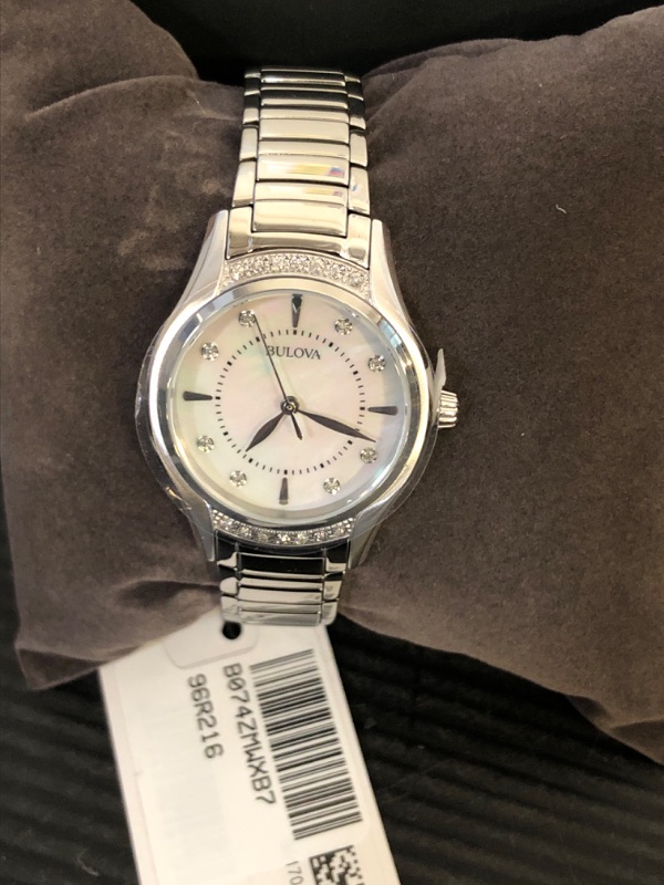 Photo 2 of Bulova Ladies' Classic Diamond 3-Hand Quartz Stainless Steel Watch, 16 Diamonds, Mother-of-Pearl Dial, Curved Mineral Crystal, Silver Tone