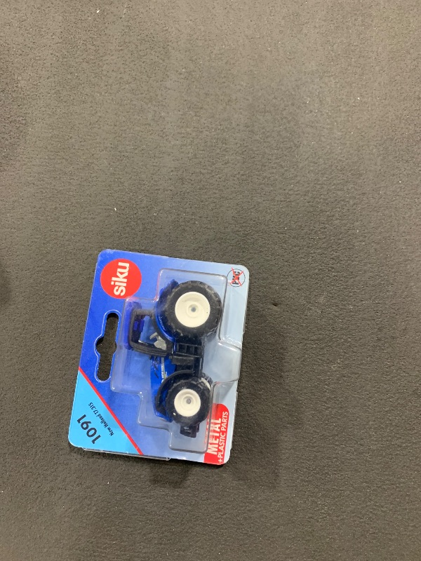 Photo 1 of Siku 1091, New Holland T7.315 Tractor, Metal/Plastic, Blue, Detachable cab and Trailer Hitch
