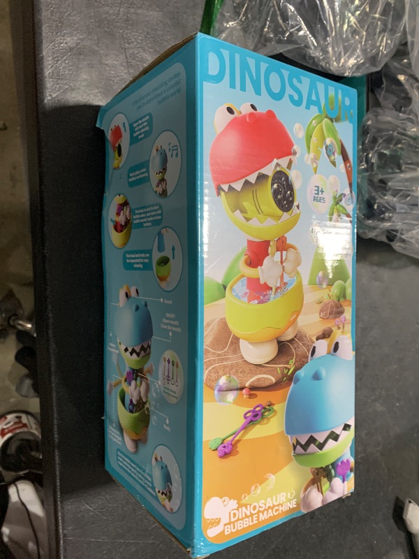 Photo 1 of Dinosaur Bubble Machine, Blower Bubbles for Kids with 12oz Bubble Solution & 4 Bubble Wands, Bubble Maker Toy for Indoor Outdoor Kids Toys Dinosaur Party Favors Birthday Gift for Boys Girls