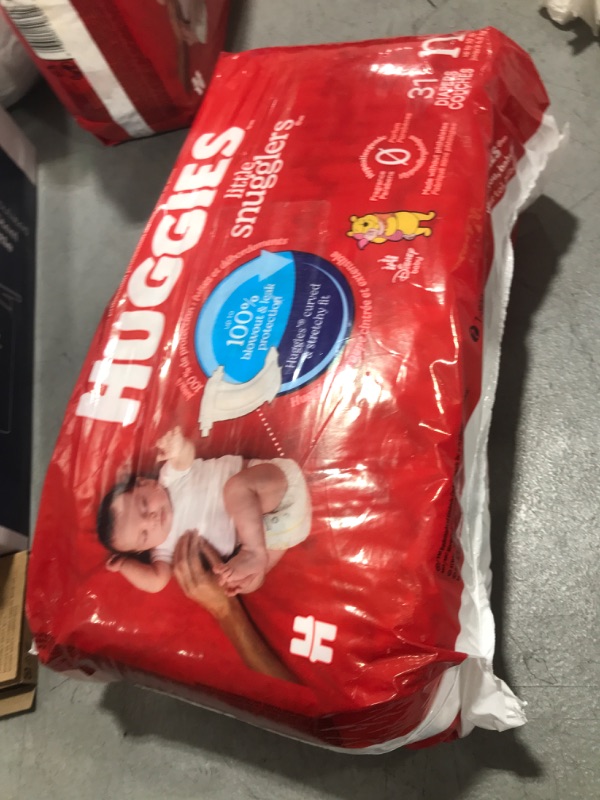 Photo 1 of Huggies Newborn Diapers, Little Snugglers Baby Diapers, Size Newborn (up to 10 lbs), 31 Count