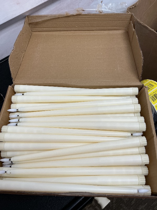 Photo 1 of Baquler 50 Pcs Flameless Taper Candles Battery Operated Bulk 12.4 Ivory LED Taper Candles Flickering LED Candlesticks for Wedding Advent Halloween Christmas Party Decor