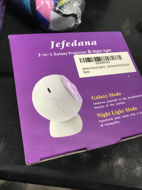 Photo 1 of Jefedana Mini Portable Galaxy Projector with Breathing Stars, Dynamic Nebula, Night Light Mode, Rechargeable Star Projector with Removable Base, Auto Spinning with Low Noise, Multicolor Light Effect