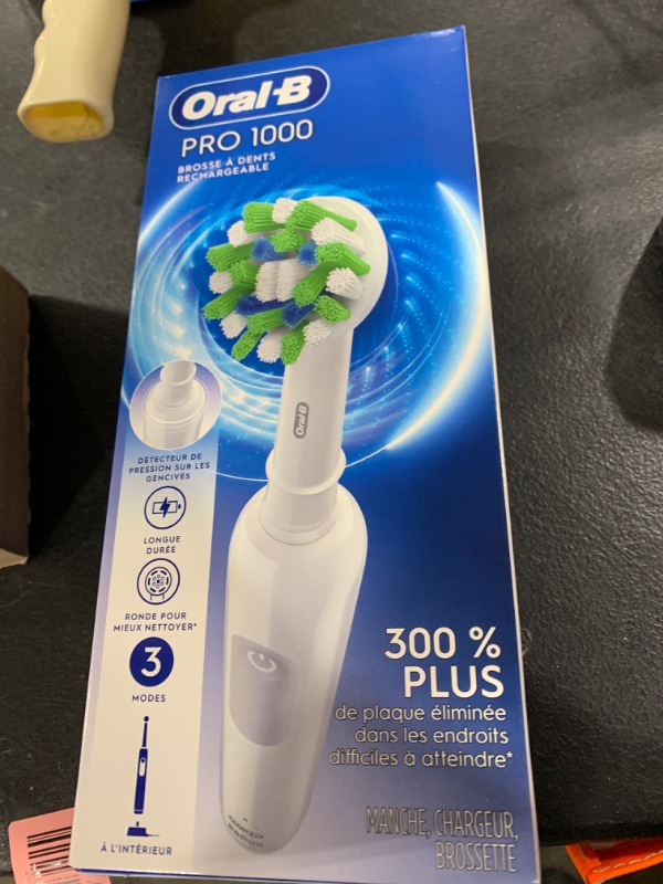 Photo 2 of (3 PACK) Oral-B Pro 1000 Rechargeable Electric Toothbrush, White