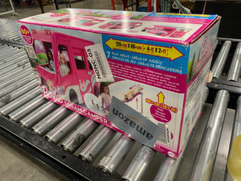 Photo 2 of Barbie Camper Playset, DreamCamper Toy Vehicle with 60 Doll-Sized Accessories Including Furniture, Pool & 30-inch Slide