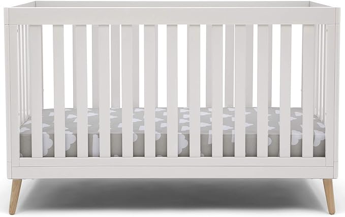 Photo 1 of Delta Children Essex 4-in-1 Convertible Baby Crib, Bianca White with Natural Legs Black
