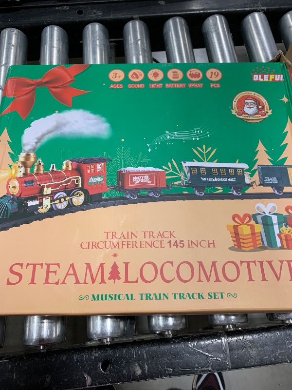 Photo 1 of OleFun Christmas Train Set, Electric Train with Water Steam, Sounds & Lights, Model Train Set for Under The Xmas Tree, Railway Kit Gifts for 3, 4, 5, 6, 7, 8+ Year Old Boy & Girl
