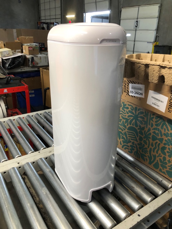 Photo 1 of ***DAMAGED - COVERED IN DENTS - SEE PICTURES***
Diaper Genie Platinum Pail (Lilly White) is Made of Durable Stainless Steel and Includes 1 Easy Roll Refill with 18 Bags That can Last up to 5 Months.