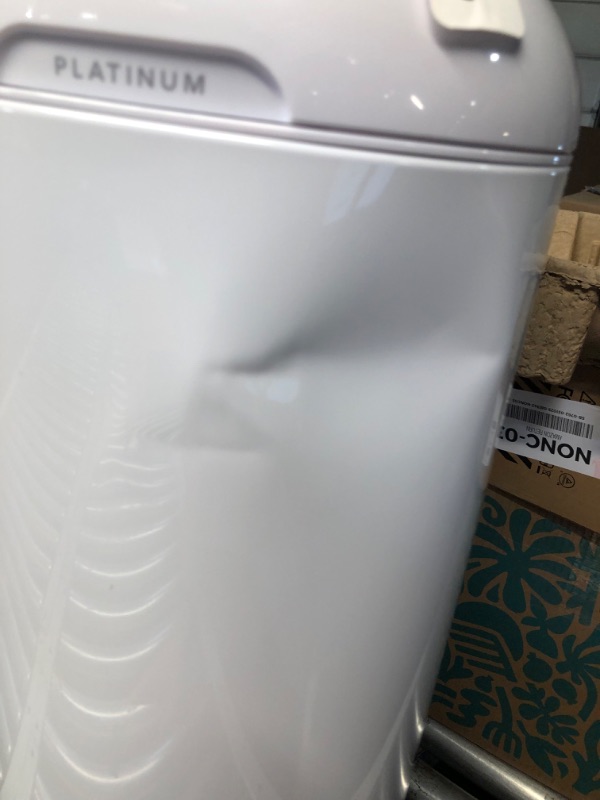 Photo 1 of ***DAMAGED - COVERED IN DENTS - SEE PICTURES***
Diaper Genie Platinum Pail (Lilly White) is Made of Durable Stainless Steel and Includes 1 Easy Roll Refill with 18 Bags That can Last up to 5 Months.