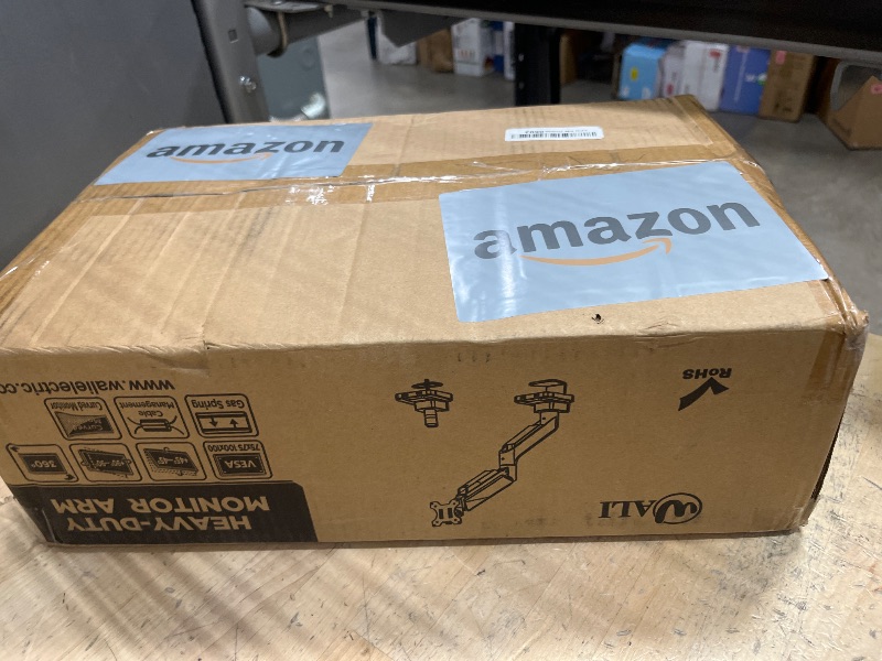 Photo 1 of WALI Single Monitor Gas Spring Desk Mount, Heavy Duty Monitor Arm for Ultrawide Screen up to 35 inch, 33 lbs. Fully Adjustable, Mounting Holes 75 and 100 (GSM001XL), Black