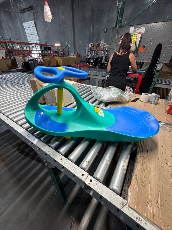 Photo 1 of (MISSING BACK WHEELS) ($89.98 VALUE) PlasmaCar Lightning Glow Rider - Inertia & Movement Powered Ride-On Toy, Light-Up Wheels, Indoor-Outdoor Play Teal & Blue