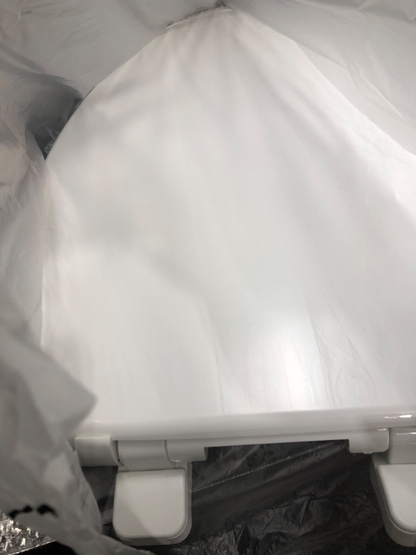 Photo 1 of **PRE OPENED, LOOKS UNUSED** Little2Big Toilet Seat with Built-In Potty Training Seat, Slow Close, Durable Plastic, ELONGATED, White