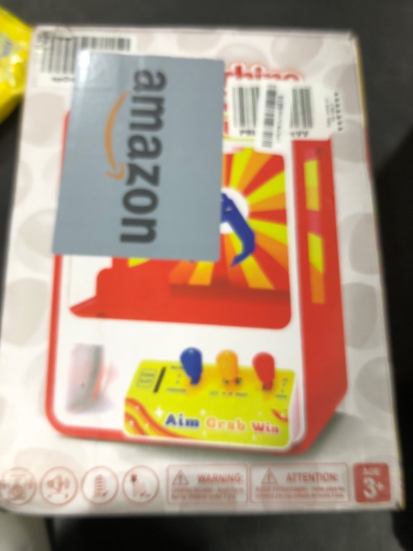 Photo 1 of JOYIN Claw Machine Arcade Toy with LED Light & Adjustable Sound, Rechargable Dispenser Toys Mini Vending Machine for Kids - Perfect Christmas & Birthday Big Gifts for Kids, Ages 3+