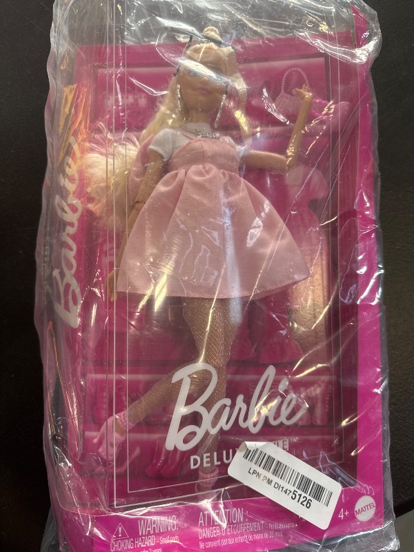 Photo 1 of Barbie Deluxe Style Doll #3 in Barbiecore Outfit, Blond Hair in Top Knot, Pink Pastel Dress with Oversized Bow and Accessories Like Mesh Tights