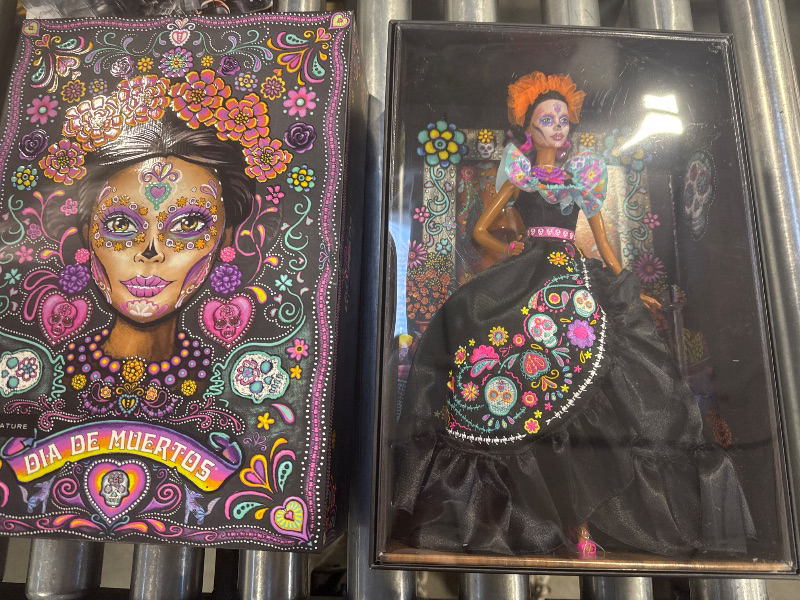 Photo 1 of Barbie Signature Doll, 2024 Día De Muertos Collectible in Black Dress with Blue Ruffle Top, Embroidered Print, and Colorful Accessories