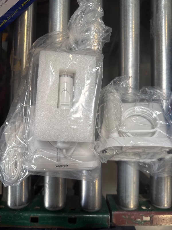 Photo 1 of Waterpik Evolution and Nano Water Flosser Combo Pack
