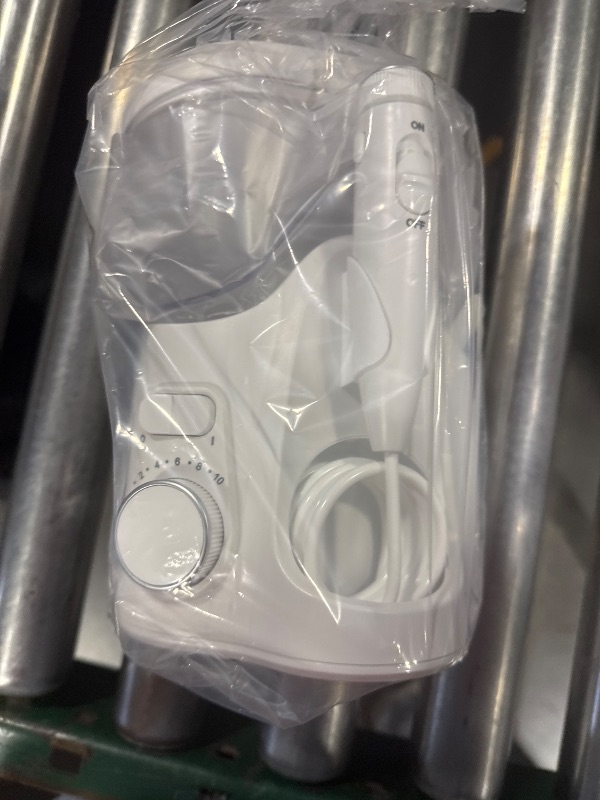 Photo 1 of Waterpik Ultra Plus and Cordless Pearl Water Flosser Combo Pack