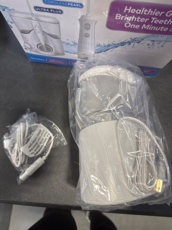 Photo 1 of Waterpik Ultra Plus and Cordless Pearl Water Flosser Combo Pack